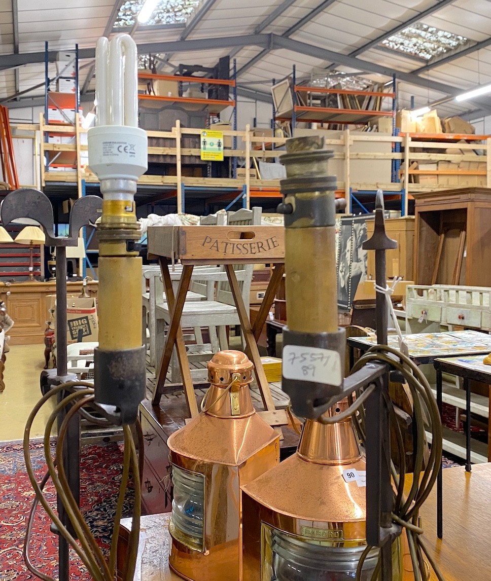 A pair of wrought iron floor lamps, height 160cm